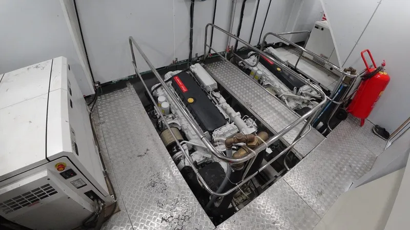  Yacht Photos Pics Engine room of 2024 Custom Modern Trawler RPH with dual engines and safety equipment.
