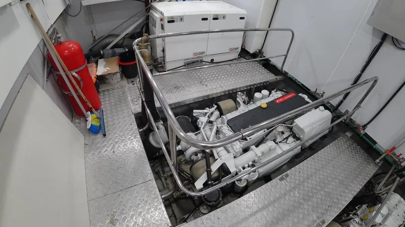  Yacht Photos Pics Engine room of 2024 Custom Modern Trawler RPH with visible machinery and safety equipment.
