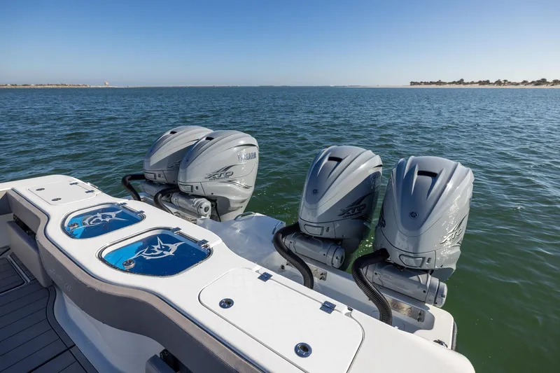 Jackie B Yacht Photos Pics 2024 Freeman 47 boat with triple Yamaha outboard engines on open water.