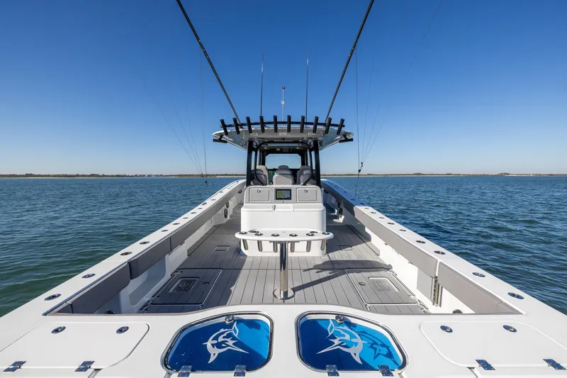 Jackie B Yacht Photos Pics 2024 Freeman 47 boat on open water, featuring spacious deck and fishing equipment.