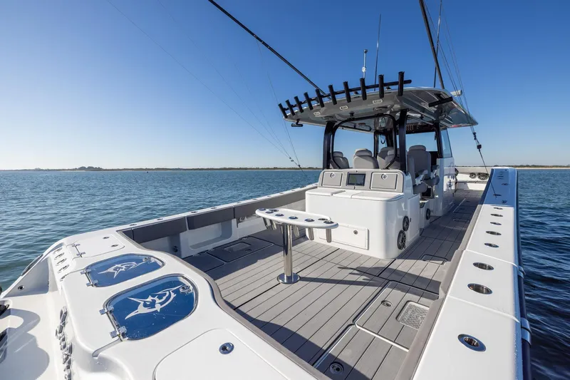 Jackie B Yacht Photos Pics 2024 Freeman 47 boat on water, featuring spacious deck and modern design.