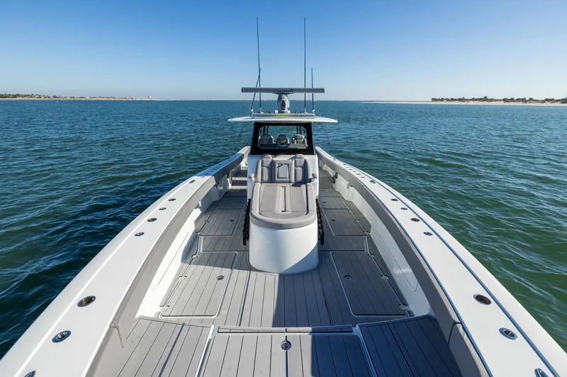 Jackie B Yacht Photos Pics 2024 Freeman 47 boat cruising on open water under clear blue skies.
