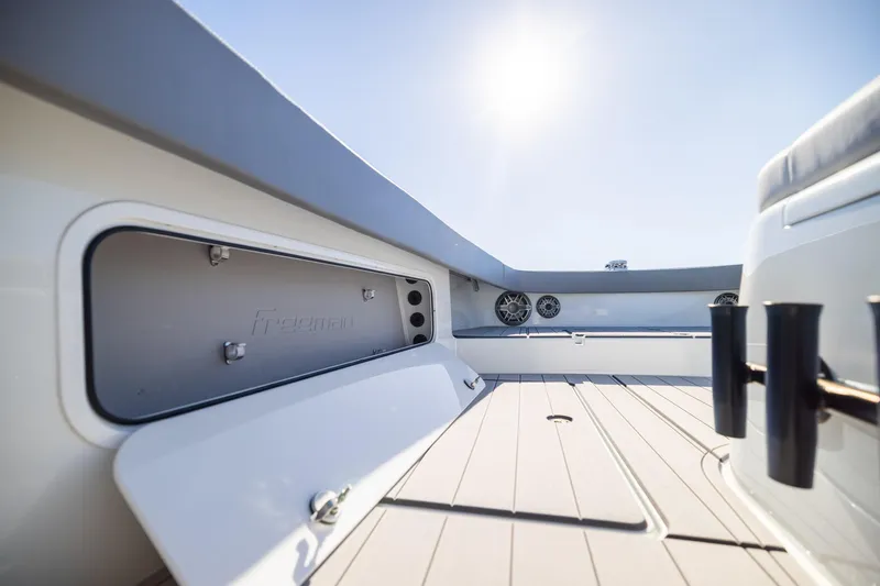 Jackie B Yacht Photos Pics 2024 Freeman 47 boat interior with open storage compartment and sleek design.