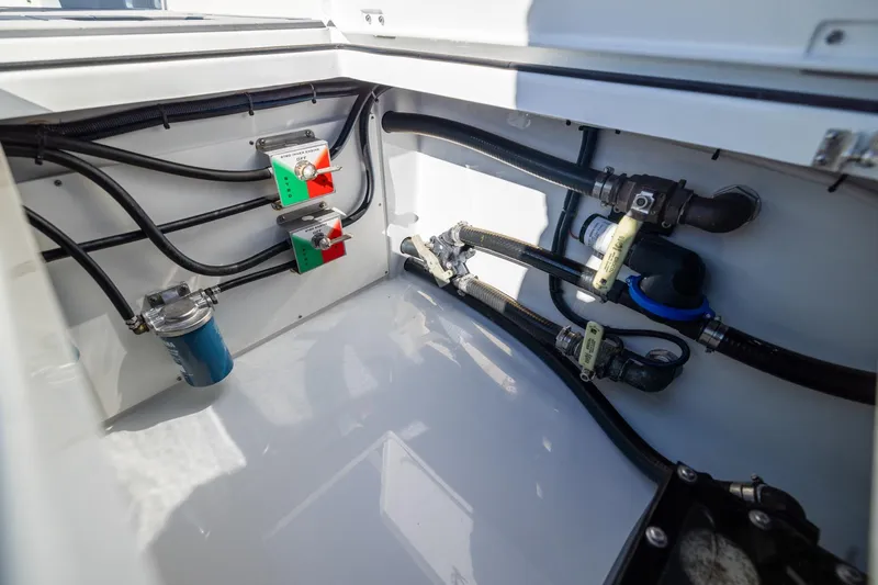 Jackie B Yacht Photos Pics 2024 Freeman 47 boat engine compartment with hoses and valves.