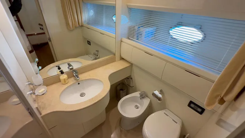  Yacht Photos Pics Luxurious bathroom in 2005 Astondoa 72 yacht with modern fixtures and elegant design.