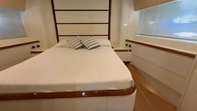  Yacht Photos Pics Luxurious bedroom interior of 2005 Astondoa 72 yacht with modern design and cozy bedding.