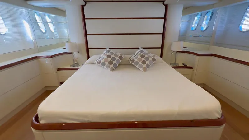  Yacht Photos Pics Luxurious bedroom interior of 2005 Astondoa 72 yacht with elegant decor and natural light.