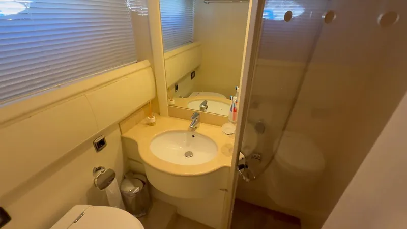  Yacht Photos Pics Luxurious bathroom in 2005 Astondoa 72 yacht with modern fixtures and elegant design.