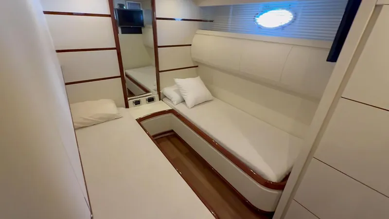  Yacht Photos Pics Luxurious cabin interior of a 2005 Astondoa 72 yacht, featuring sleek design and comfortable bedding.