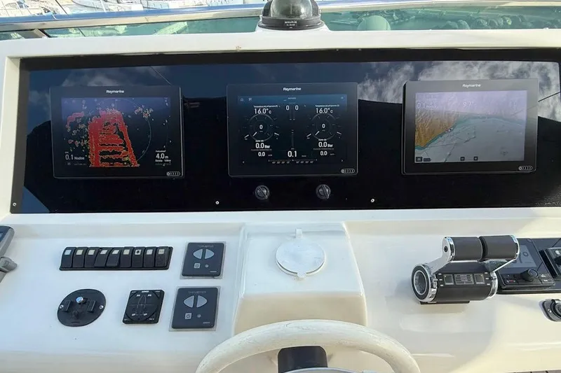  Yacht Photos Pics Cockpit of 2005 Astondoa 72 yacht with navigation displays and controls.
