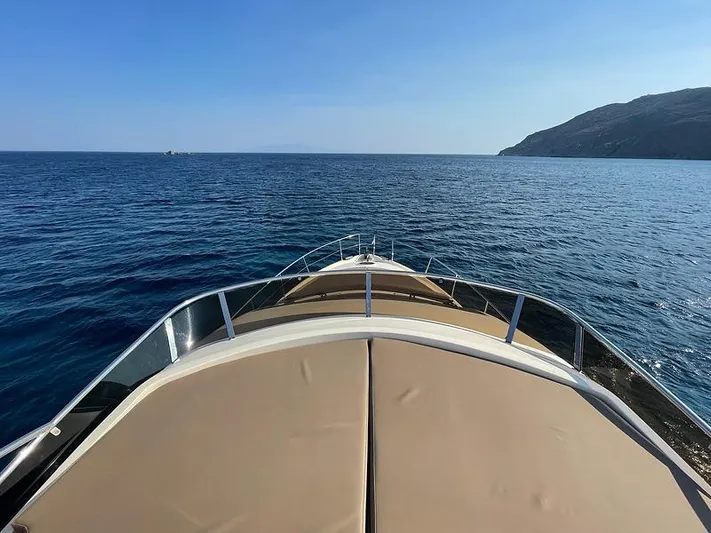  Yacht Photos Pics Bow view of 2007 Aicon 52 yacht cruising on open sea near a coastline.