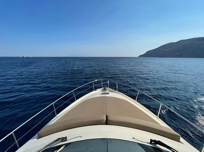  Yacht Photos Pics Bow view of 2007 Aicon 52 yacht cruising on open sea near a coastline.