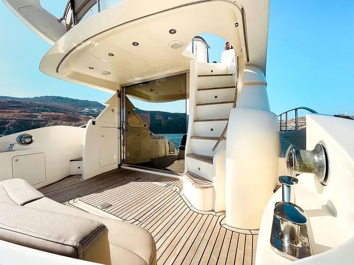  Yacht Photos Pics Luxurious 2007 Aicon 52 yacht deck with elegant seating and staircase.