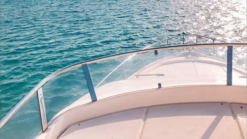  Yacht Photos Pics Bow of 2007 Aicon 52 yacht cruising on clear blue water.