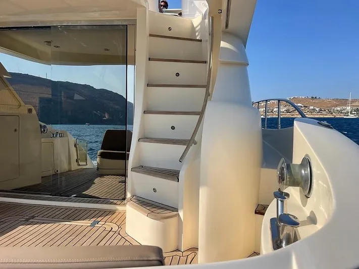  Yacht Photos Pics Luxurious 2007 Aicon 52 yacht deck with stairs and ocean view.