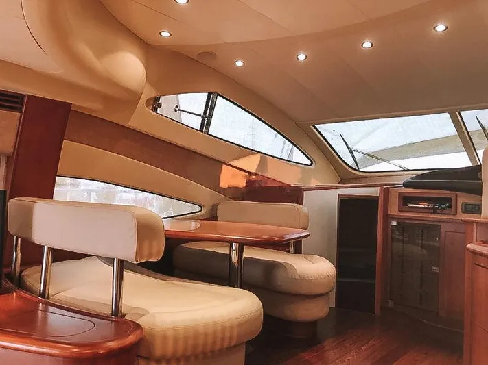  Yacht Photos Pics Luxurious interior of a 2007 Aicon 52 yacht with elegant seating and wood finishes.