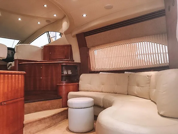  Yacht Photos Pics Luxurious interior of 2007 Aicon 52 yacht with plush seating and elegant wood finishes.