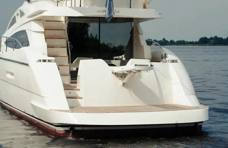  Yacht Photos Pics Luxury 2007 Aicon 52 yacht on calm water, rear view.