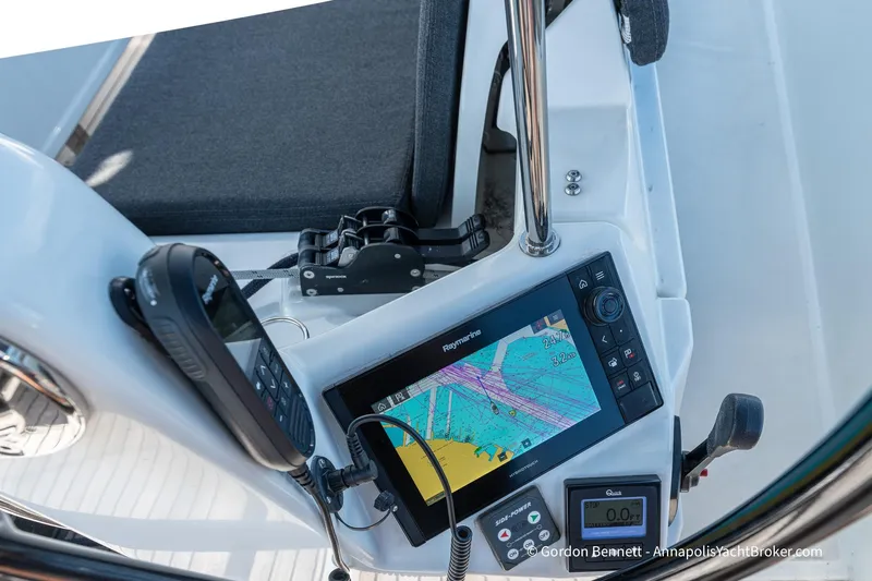 Boat Tox Yacht Photos Pics Cockpit of 2022 Jeanneau Sun Odyssey 440 with navigation equipment and controls.