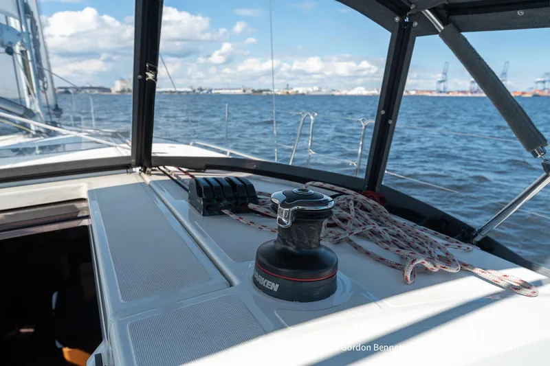 Boat Tox Yacht Photos Pics 2022 Jeanneau Sun Odyssey 440 sailboat deck with winch and ropes, ocean view.