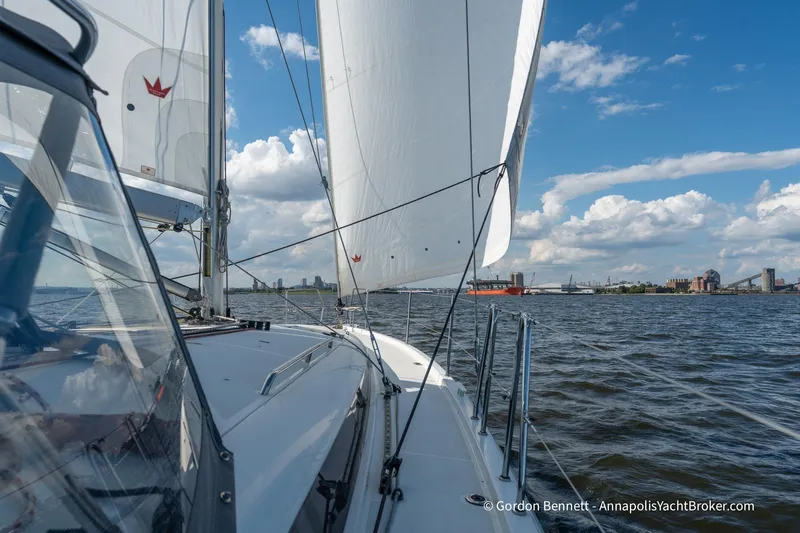 Boat Tox Yacht Photos Pics Sailing Jeanneau Sun Odyssey 440, 2022 model, on a sunny day with city skyline.