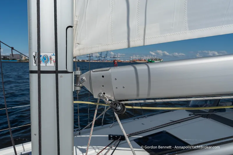 Boat Tox Yacht Photos Pics Jeanneau Sun Odyssey 440 sailboat mast and boom detail, 2022 model, on open water.