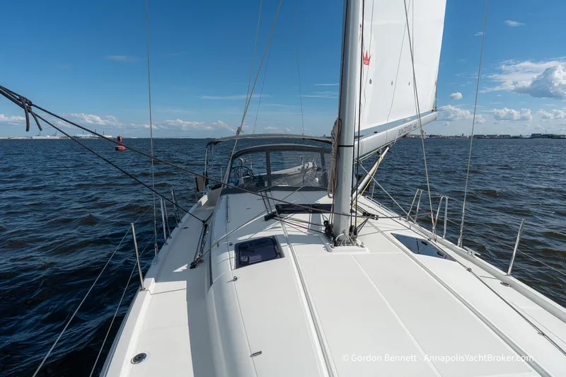 Boat Tox Yacht Photos Pics 2022 Jeanneau Sun Odyssey 440 sailing on open water under clear blue skies.