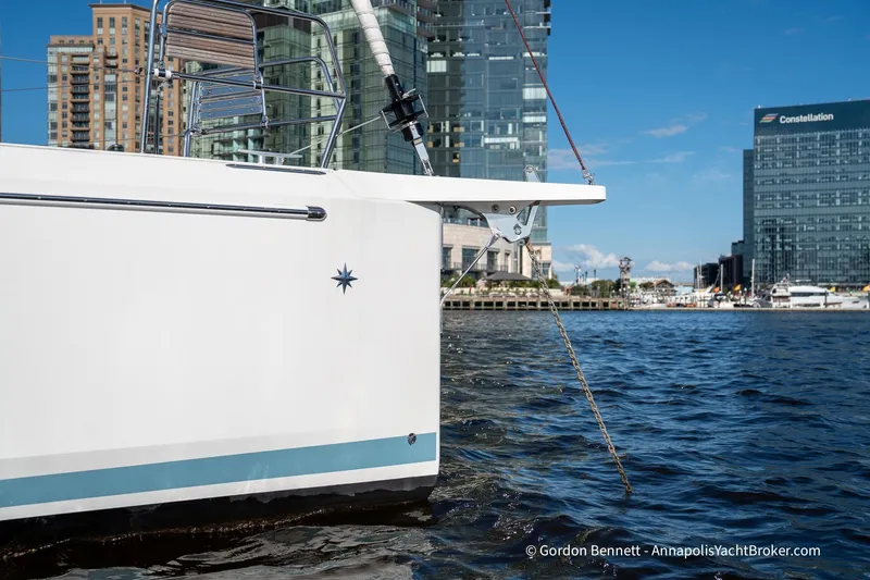 Boat Tox Yacht Photos Pics 2022 Jeanneau Sun Odyssey 440 yacht docked in urban marina setting.