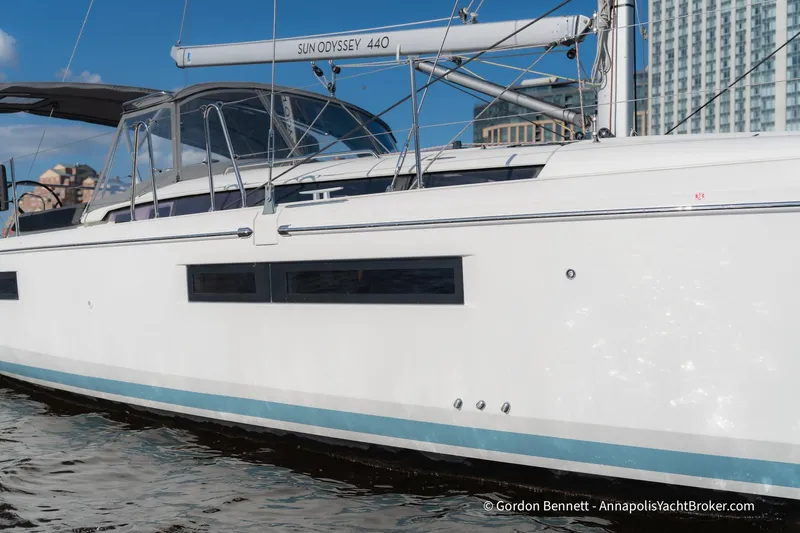 Boat Tox Yacht Photos Pics 2022 Jeanneau Sun Odyssey 440 yacht docked, showcasing sleek design and modern features.
