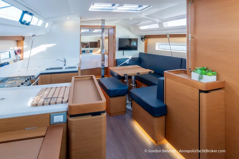 Boat Tox Yacht Photos Pics Modern interior of 2022 Jeanneau Sun Odyssey 440 yacht with sleek design and cozy seating.