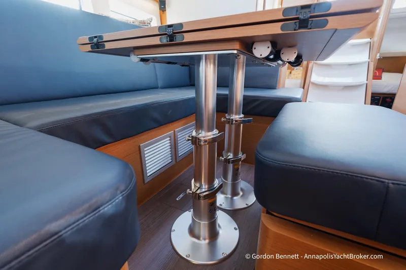 Boat Tox Yacht Photos Pics Interior of 2022 Jeanneau Sun Odyssey 440 yacht with modern seating and adjustable table.