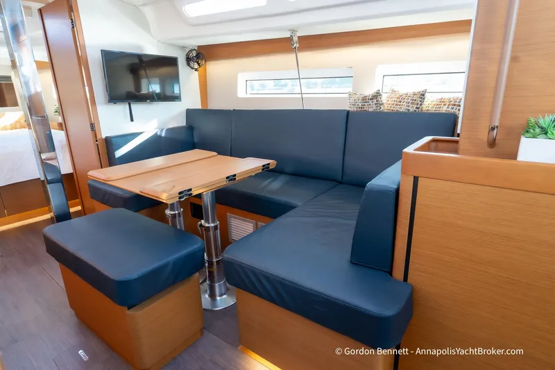 Boat Tox Yacht Photos Pics Interior of 2022 Jeanneau Sun Odyssey 440 yacht with modern seating and dining area.