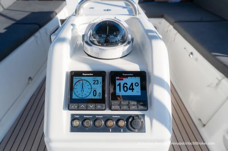 Boat Tox Yacht Photos Pics Cockpit instruments on 2022 Jeanneau Sun Odyssey 440 yacht, featuring Raymarine displays and compass.