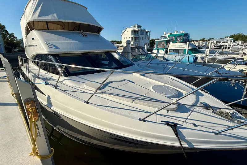  Yacht Photos Pics 2009 Carver 43 Super Sport yacht docked at marina under clear blue sky.
