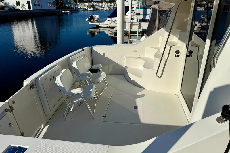  Yacht Photos Pics 2009 Carver 43 Super Sport yacht deck with chairs, docked at marina.