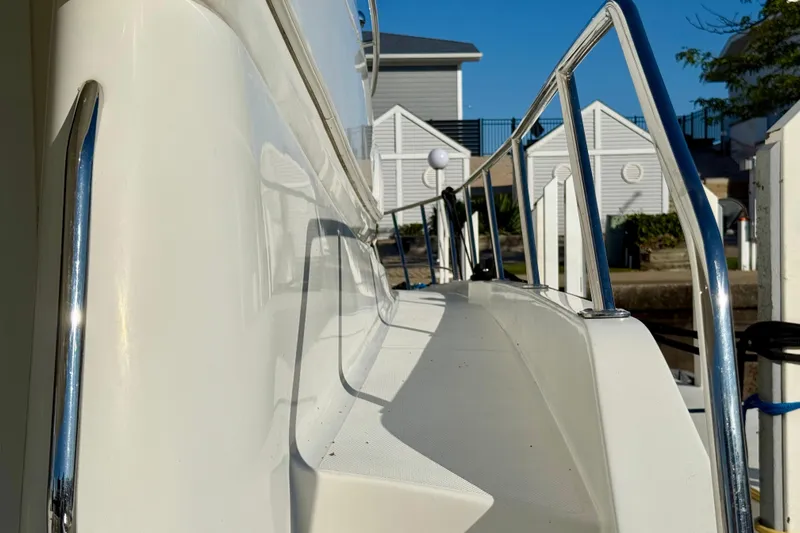  Yacht Photos Pics 2009 Carver 43 Super Sport yacht deck with stainless steel railings in marina.