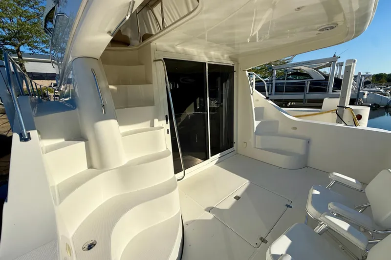  Yacht Photos Pics 2009 Carver 43 Super Sport yacht deck with stairs and seating area.