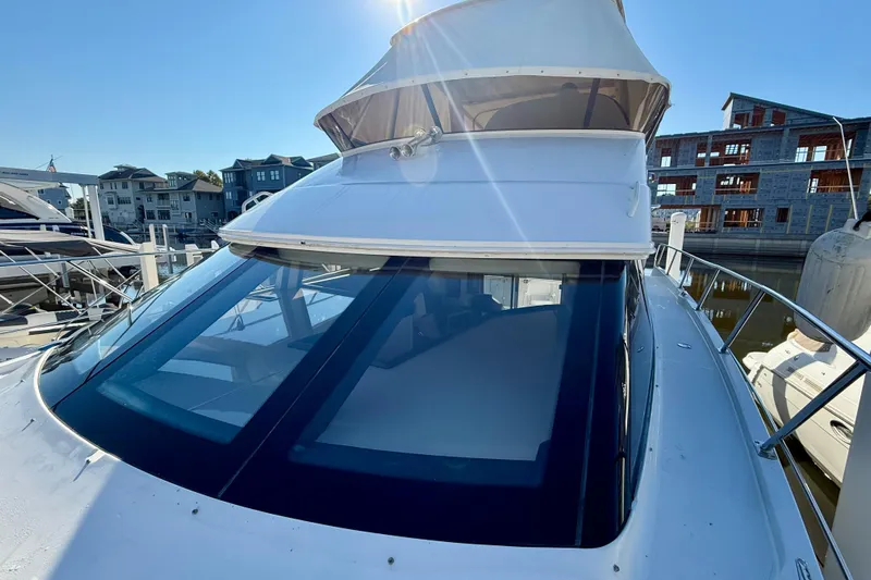  Yacht Photos Pics 2009 Carver 43 Super Sport yacht docked, showcasing sleek design and spacious upper deck.