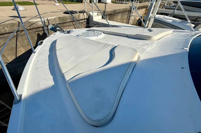  Yacht Photos Pics 2009 Carver 43 Super Sport yacht deck with sun pads and railing.