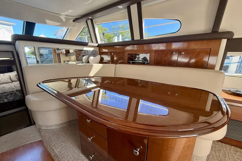  Yacht Photos Pics Luxurious interior of 2009 Carver 43 Super Sport yacht with polished wood table.