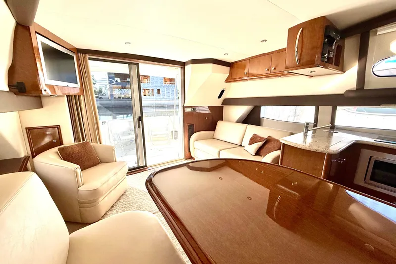  Yacht Photos Pics Luxurious interior of 2009 Carver 43 Super Sport yacht with elegant furnishings and modern amenities.