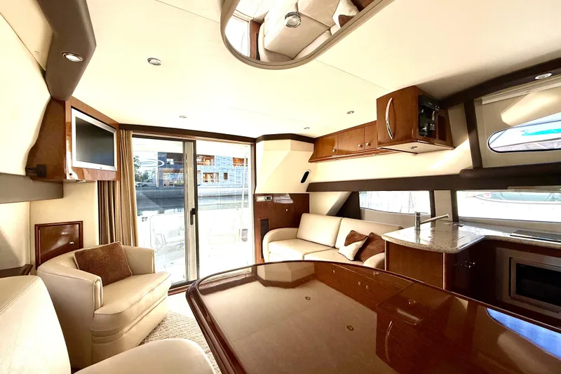  Yacht Photos Pics Luxurious interior of 2009 Carver 43 Super Sport yacht with elegant furnishings and modern amenities.