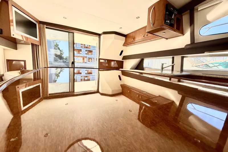  Yacht Photos Pics Luxurious interior of 2009 Carver 43 Super Sport yacht with polished wood finishes.