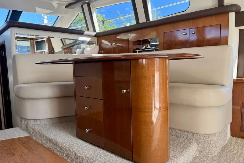 Yacht Photos Pics Luxurious interior of 2009 Carver 43 Super Sport yacht with elegant wood cabinetry.