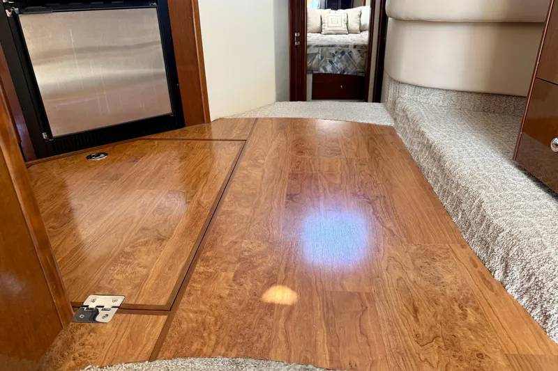  Yacht Photos Pics Interior of 2009 Carver 43 Super Sport with wood flooring and carpeted steps.