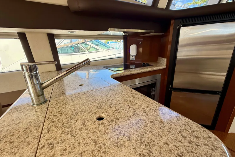  Yacht Photos Pics Luxurious kitchen interior of 2009 Carver 43 Super Sport yacht with granite countertops.