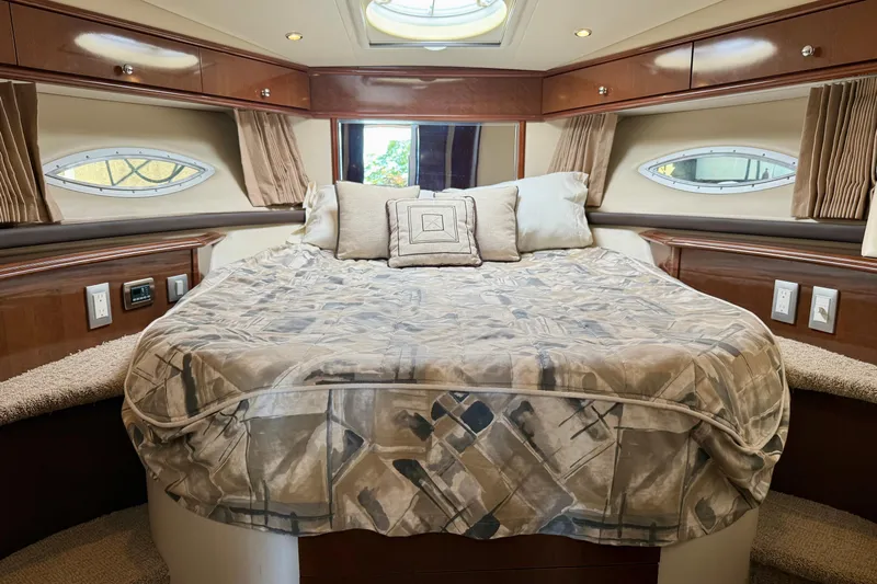  Yacht Photos Pics Luxurious cabin interior of 2009 Carver 43 Super Sport yacht with cozy bed.