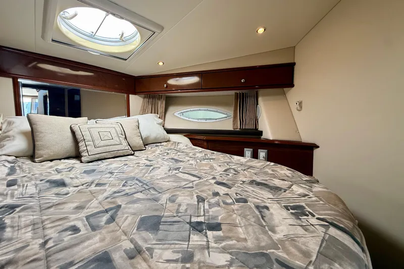  Yacht Photos Pics Luxurious bedroom interior of 2009 Carver 43 Super Sport yacht with stylish bedding.