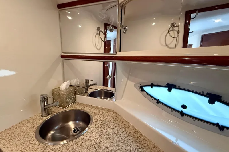  Yacht Photos Pics Luxurious bathroom interior of 2009 Carver 43 Super Sport yacht with granite countertop.