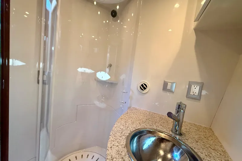  Yacht Photos Pics Bathroom interior of 2009 Carver 43 Super Sport yacht with modern sink and shower.